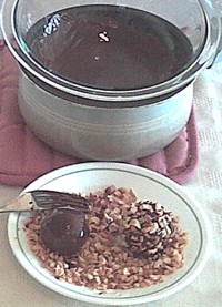 rolling peanut butter balls in melted chocolate