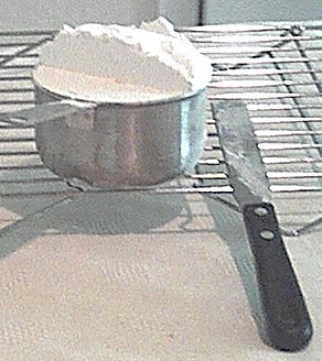 scaling flour to bake cookies